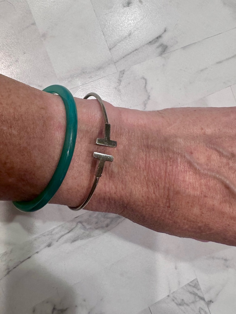 Silver tone T bar bangle. Size Small/Medium